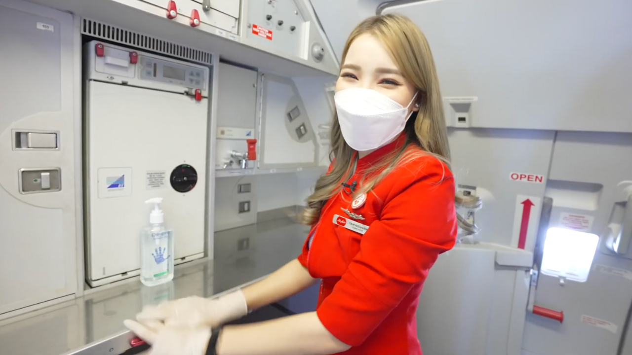 Flight attendant in galley