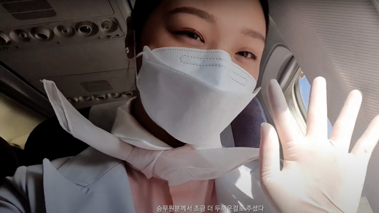 Flight attendant waving